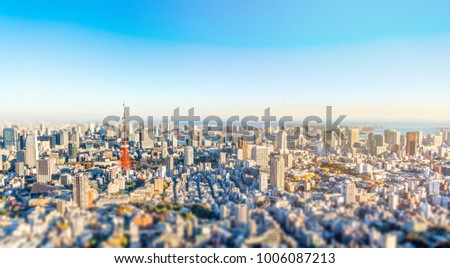 Asia Business concept for real estate and corporate construction - panoramic modern city skyline bird eye aerial view under golden sun in Roppongi Hill, Tokyo, Japan. Miniature Tilt-shift effect