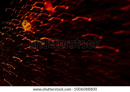 Abstract Orange Colour Light Motion Over Dark Background. Slow Shutter Speed , With Motion Blur Effect To Show Fast Movement