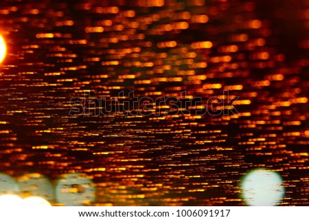 Abstract Orange Colour Light Motion Over Dark Background With Bokeh . Slow Shutter Speed , With Motion Blur Effect To Show Fast Movement