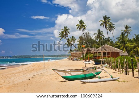 tropical solitude - beach scene with boat. Sri lanka