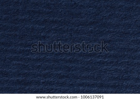 Dark blue paper, horizontal lines. High resolution photo.
