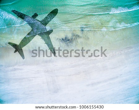 Aerial View of lonely beach with shadow of huge airplane