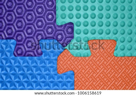 Colorful textured puzzles - violet, blue, light blue, orange. Illustrating concepts of choices, combination, connected decisions, working together