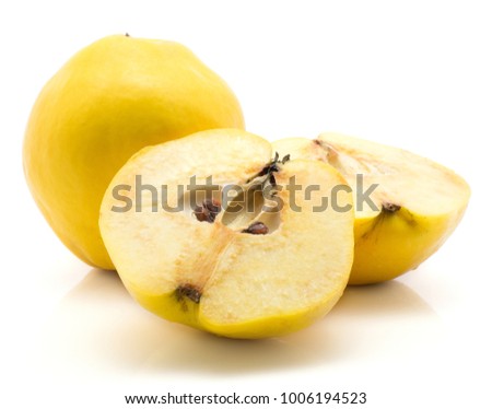 One yellow quince with two halves isolated on white background raw ripe