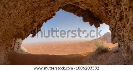 Exploring a Cave in Sharjah Desert Royalty-Free Stock Photo #1006203382