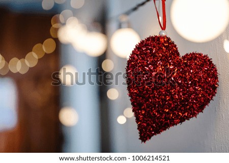 Red heart with vintage shiny confetti on background picture bokeh and bulbs light. love. Valentines day.