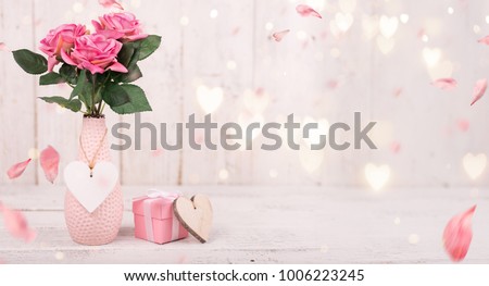 Flowers composition for Valentine's, Mother's or Women's Day. Pink flowers on old white wooden background. Still-life. Royalty-Free Stock Photo #1006223245