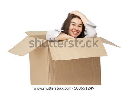 A young woman in a box , isolated on white background