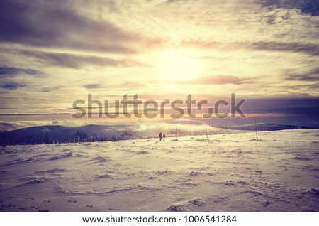 Winter mountain landscape at sunset, color toned picture.