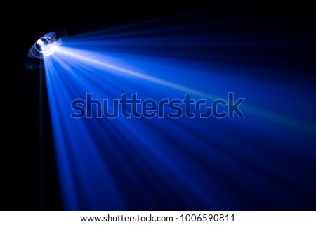 projector beautiful lighting . wide lens equipment for show presentation at night . smoke abstract background . Royalty-Free Stock Photo #1006590811