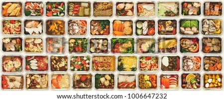 Collection of take away foil boxes with healthy food. Set of containers with everyday meals - meat, vegetables and law fat snacks on white background, top view Royalty-Free Stock Photo #1006647232