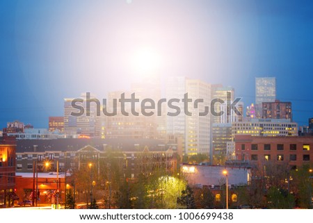 Denver Colorado bright sunlight shining above the downtown skyline 