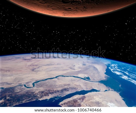 Mars and earth. Distance between them. The elements of this image furnished by NASA.
