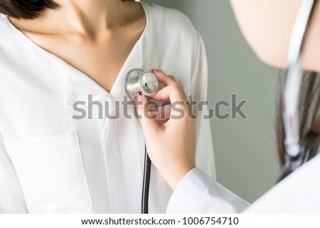 Doctor is using a stethoscope for patient examination. To hear the heart rate, For patients with heart disease. Royalty-Free Stock Photo #1006754710