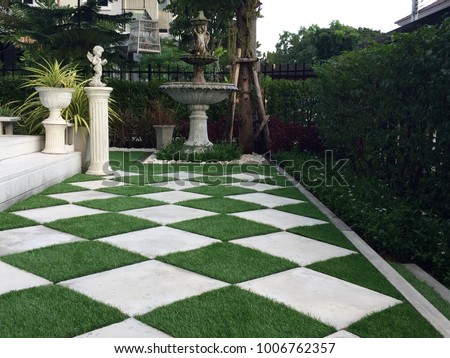 Walkway around home by artificial grass , architecture design of grass field around home, artificial grass, home outdoor decoration concept Royalty-Free Stock Photo #1006762357