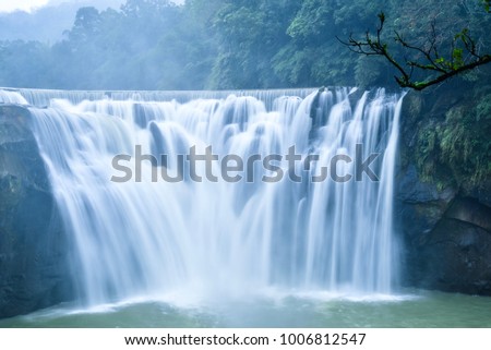 Stunning View of Shifen Waterfall in Pingxi District, Taiwan Royalty-Free Stock Photo #1006812547