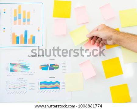 whiteboard blank post-it colored notes with graph sheet database with business planning,Blank paper notes on whiteboard and graph sheet database with accounting document,Brainstorming concept,Memo,