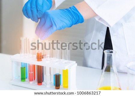 Researcher scientist mixing chemical in tube., Laboratory concept.