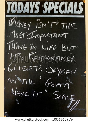 An amusing Sign depicting the value of money compared with oxygen in life                   