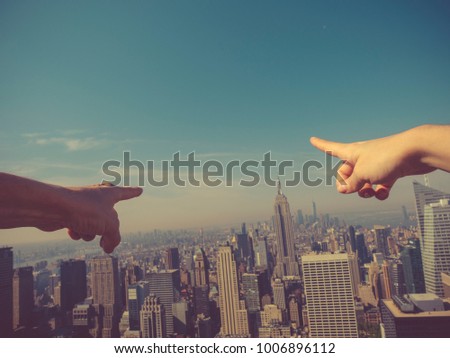 Finger showing the skyscrapers outdoors