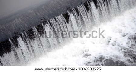A picture of the flowing water. The dam is designed to regulate the water level in rivers within the city and to provide technical water to industrial objects