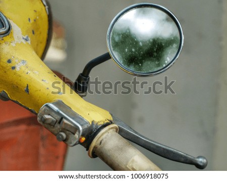 Old Motorcycle handlebar. Side mirror on motorbike