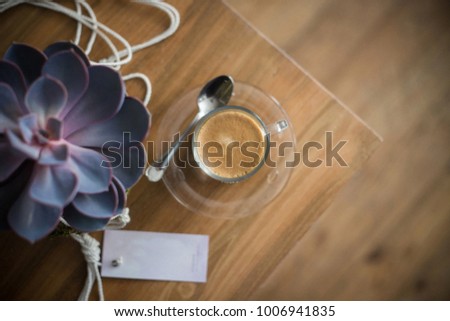 Coffee on a table with flower