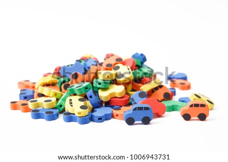 Many multi-colored cars on a white background, isolated. Car dump. Car recycling.