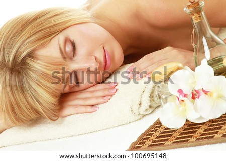 Young blonde woman at spa procedure
