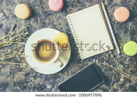 Macaroons and coffee. Breakfast. Selective focus.