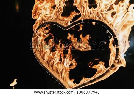 heart shaped firework on black background, fire show in night. happy valentine's day card. bengal fire burning heart. space for text. wedding or valentine concept. happy new year