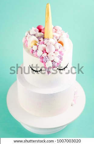 Unicorn cake on a mint green background