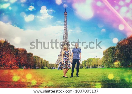 Lovers near the Eiffel Tower. Selective focus.