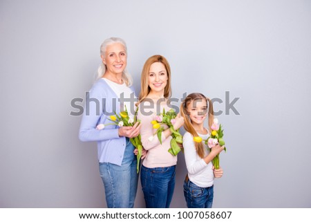 People positivity event feminine motherhood parenthood maternity shiny face concept. Side profile view photo of beautiful cute lovely tender mama granny schoolgirl with tulips isolated gray background