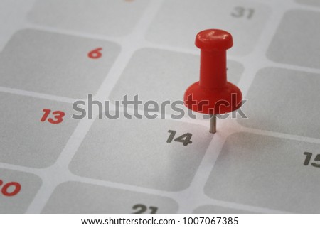 Red pin put on the calendar background in number fourteen concept of Valentine's Day.