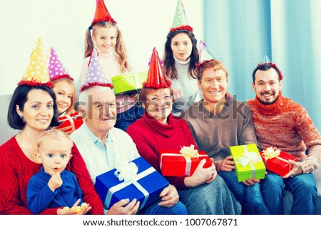 Family members making a family photo during reunion party