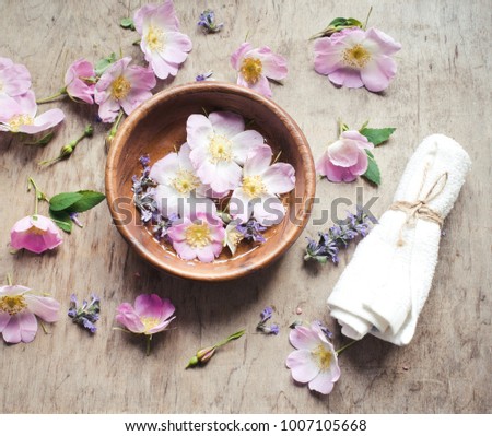 SPA set with flowers on a wooden background/toned photo