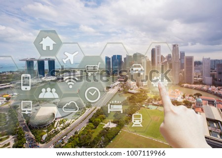 People use AR application with smart city. Hand touching virtual interface for city information. Augmented reality concept for business and technology.