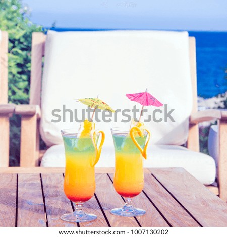 Cocktails on the background of the sea on the table