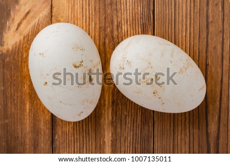 top view goose eggs on wood background