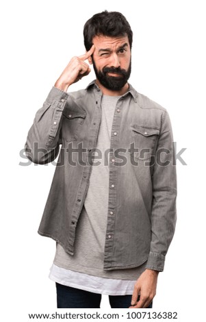 Handsome man with beard thinking on white background