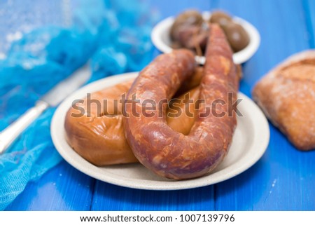 smoked portuguese sausages on white plate