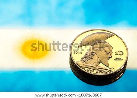 coins Bitcoin, against the background of Argentina flag, concept of virtual money, close-up. Conceptual image of digital crypto currency.