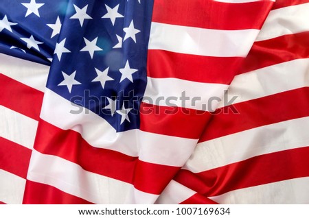 The flag of America is red in white and blue