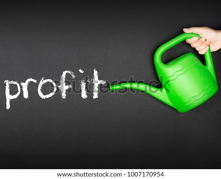 A green watering can and profit word