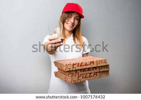Pizza delivery woman holding a bulb on textured background