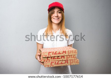 Pizza delivery woman on textured background