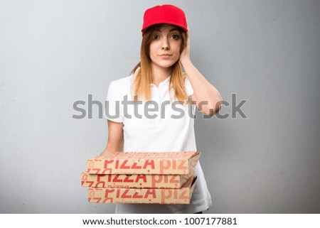 Pizza delivery woman covering her ears on textured background