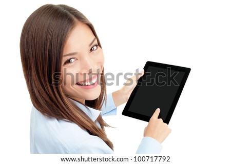 Tablet computer. Woman using digital tablet computer PC happy isolated on white background. Focus on both tablet and face. Beautiful mixed race Asian / Caucasian woman in business shirt.
