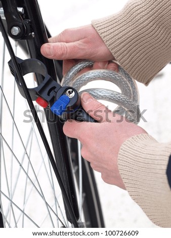 Protecting a bicycle from a robbery by tying